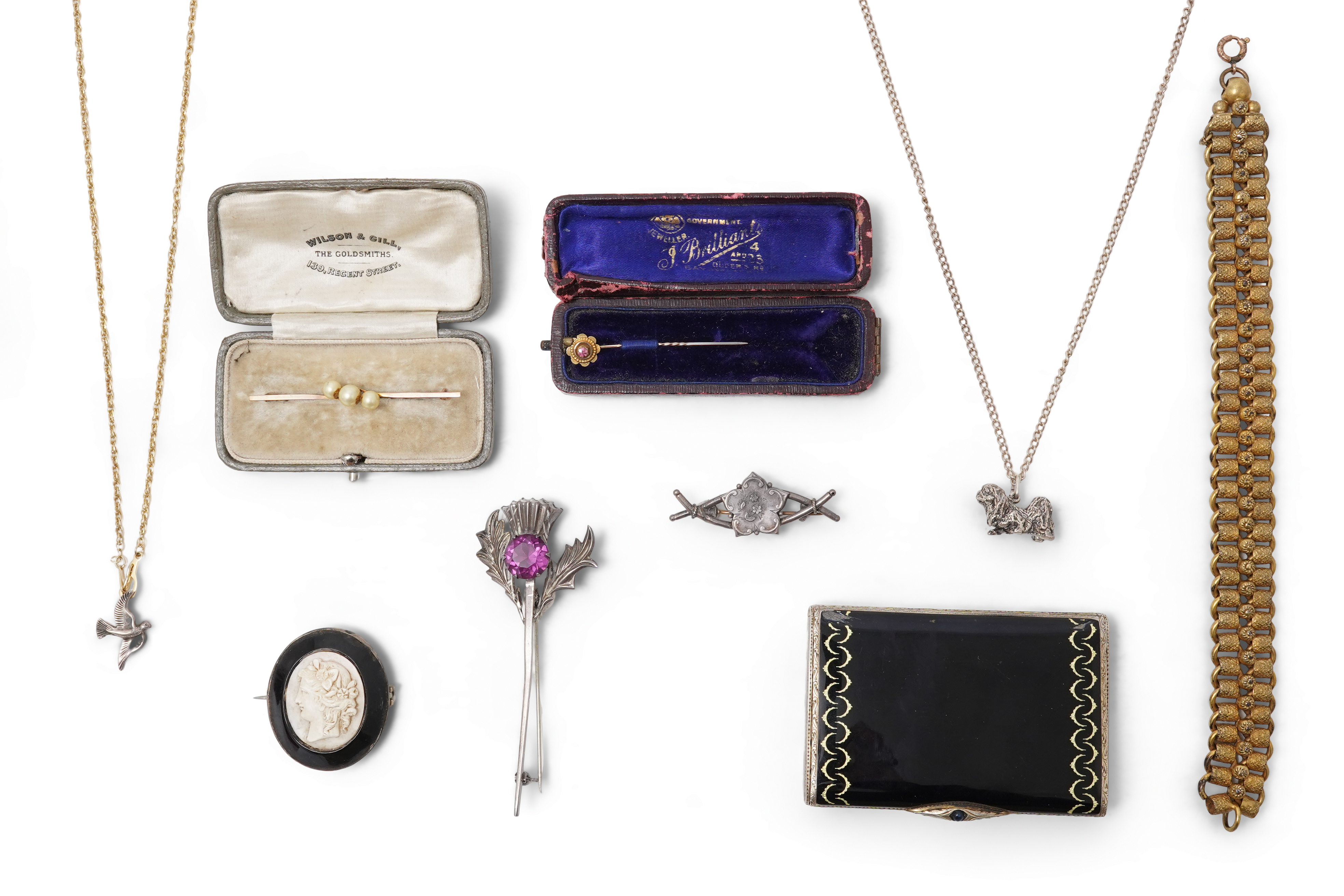 A collection of jewels including an Art Deco silver cigarette case